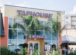 Sunny day at the entrance of the Taphouse Bar & Grille entrance