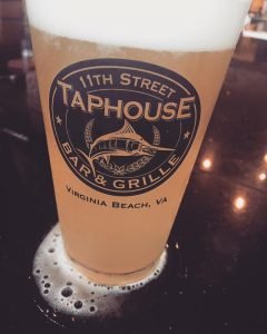 11th street taphouse glass full of beer