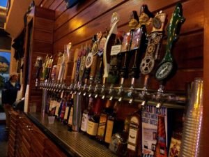 tap handles lined up down a bar